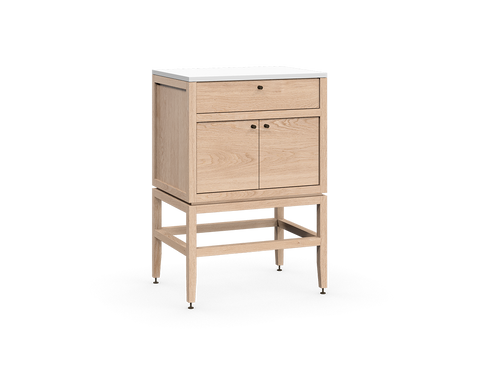 Coquo modular bathroom vanity with fix front and two doors in natural oak with metal handles.